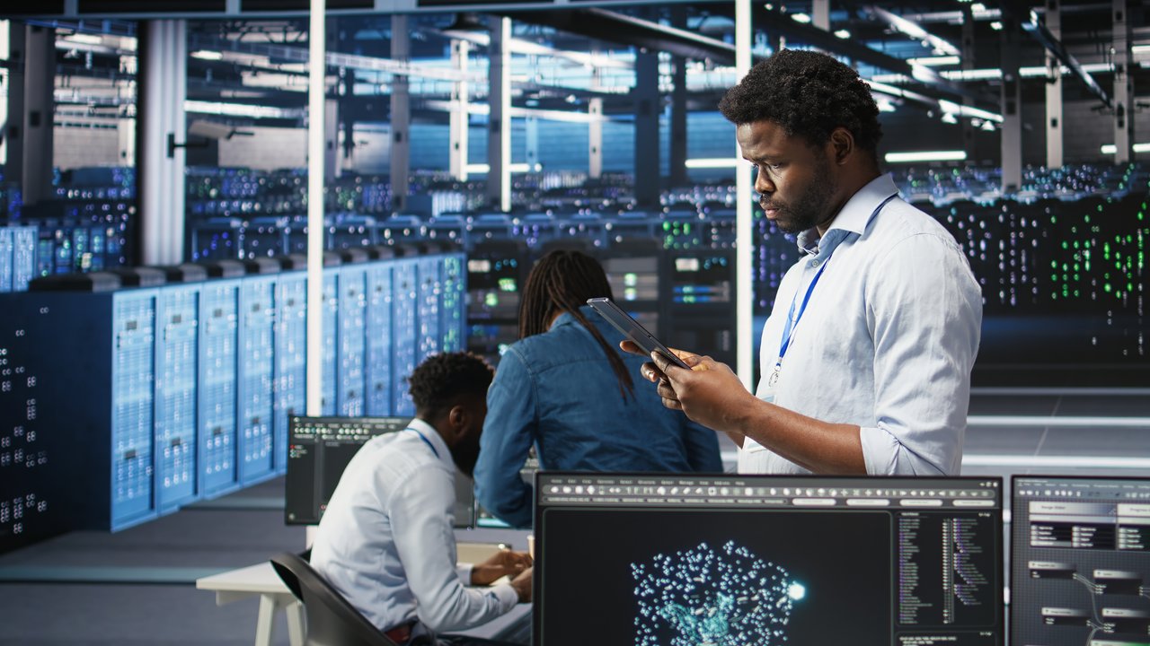 Data center engineer reviewing enterprise analytics