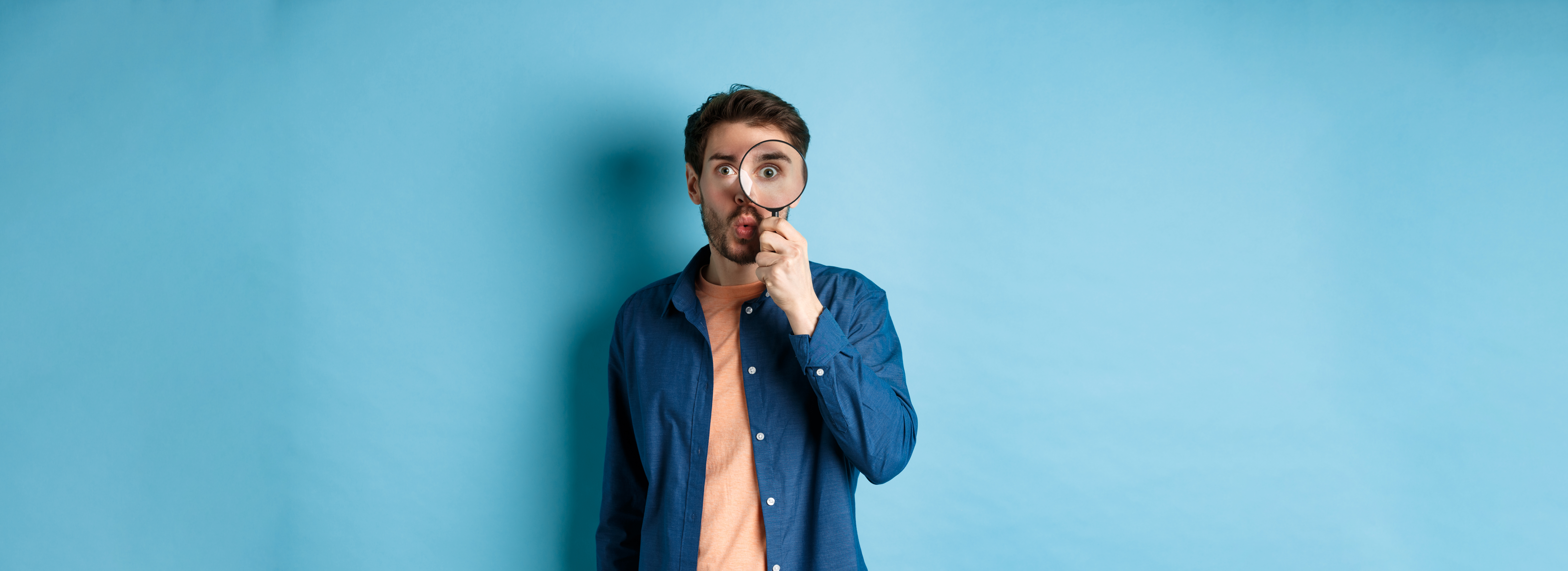 Person searching with a magnifying glass